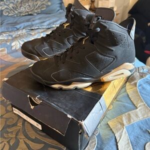 Jordan Black and Gold High-Top Sneakers